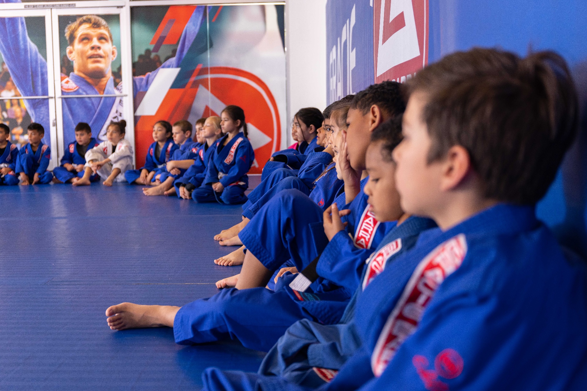 Kids Jiu-Jitsu class sitting in formation at Gracie Barra Whittier